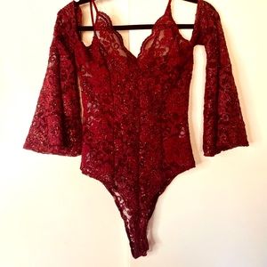 Beautiful off the shoulder glitter and lace body suit.